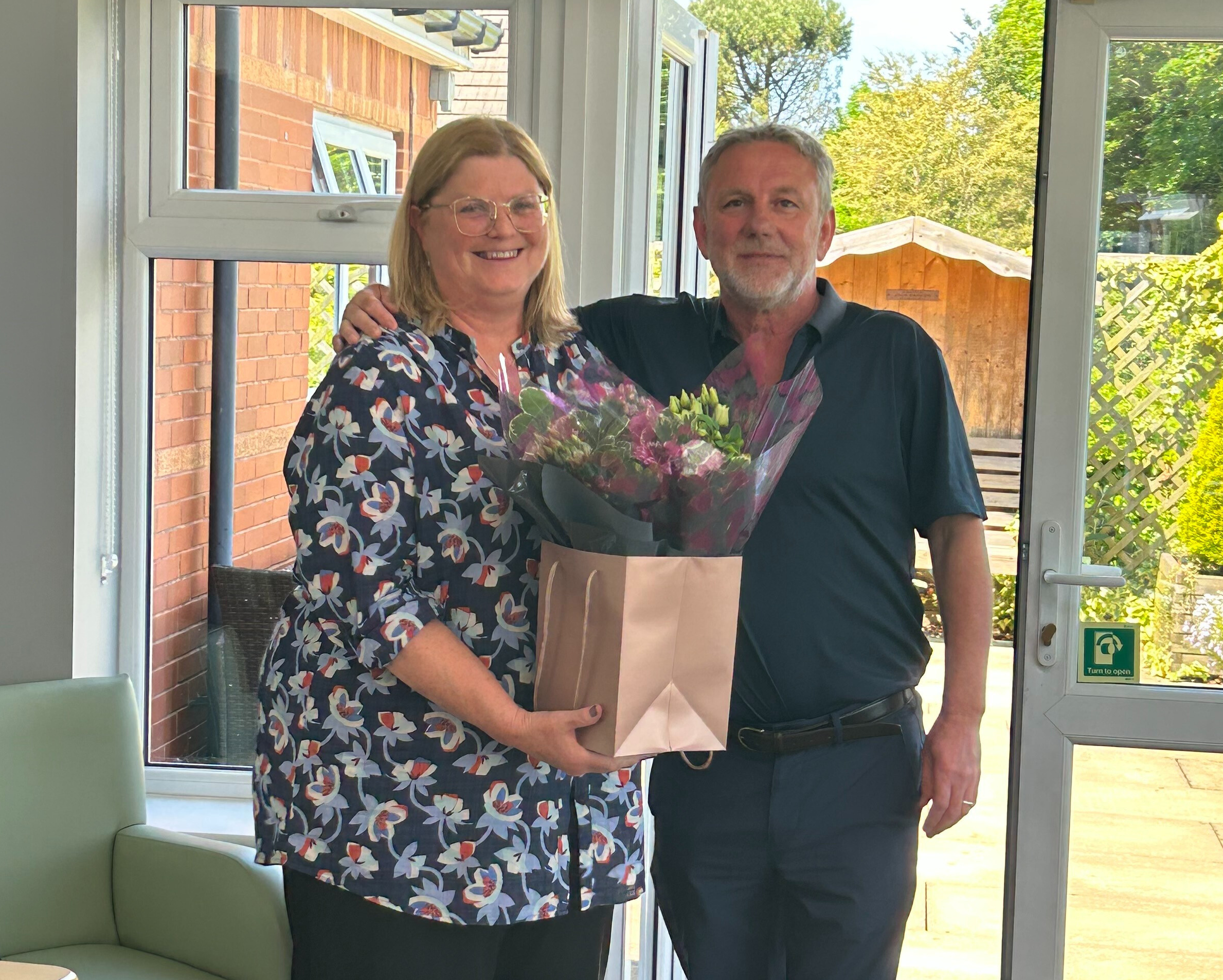 Rotherham Hospice CEO Sally Napper being wished well on her retirement by Head of Trustees Bill Patterson