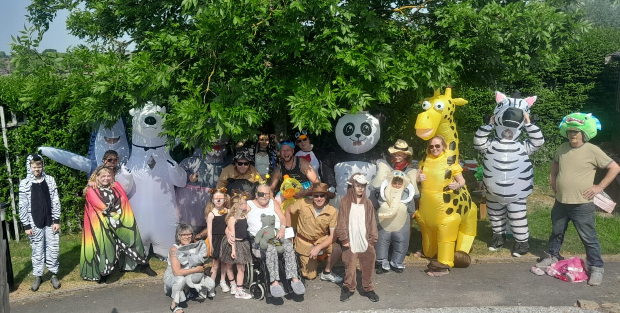 lots of people dressed up as different zoo animals