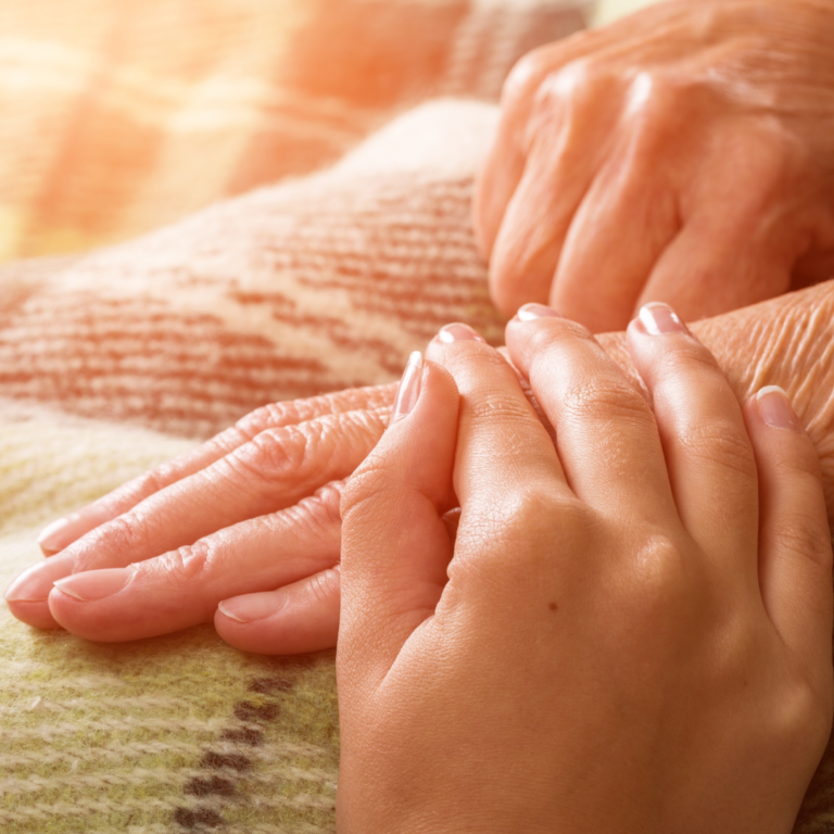 Carer holding hands
