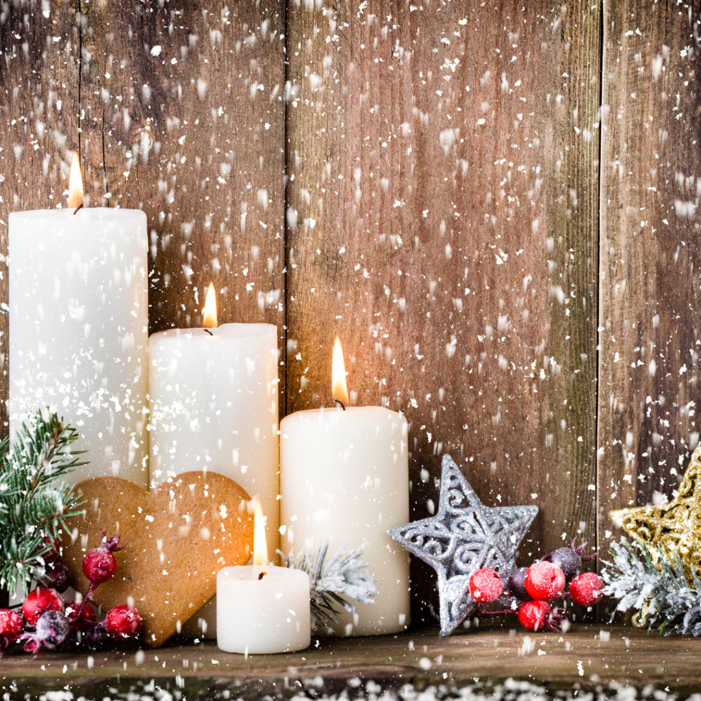 Christmas candles against a backdrop of snow