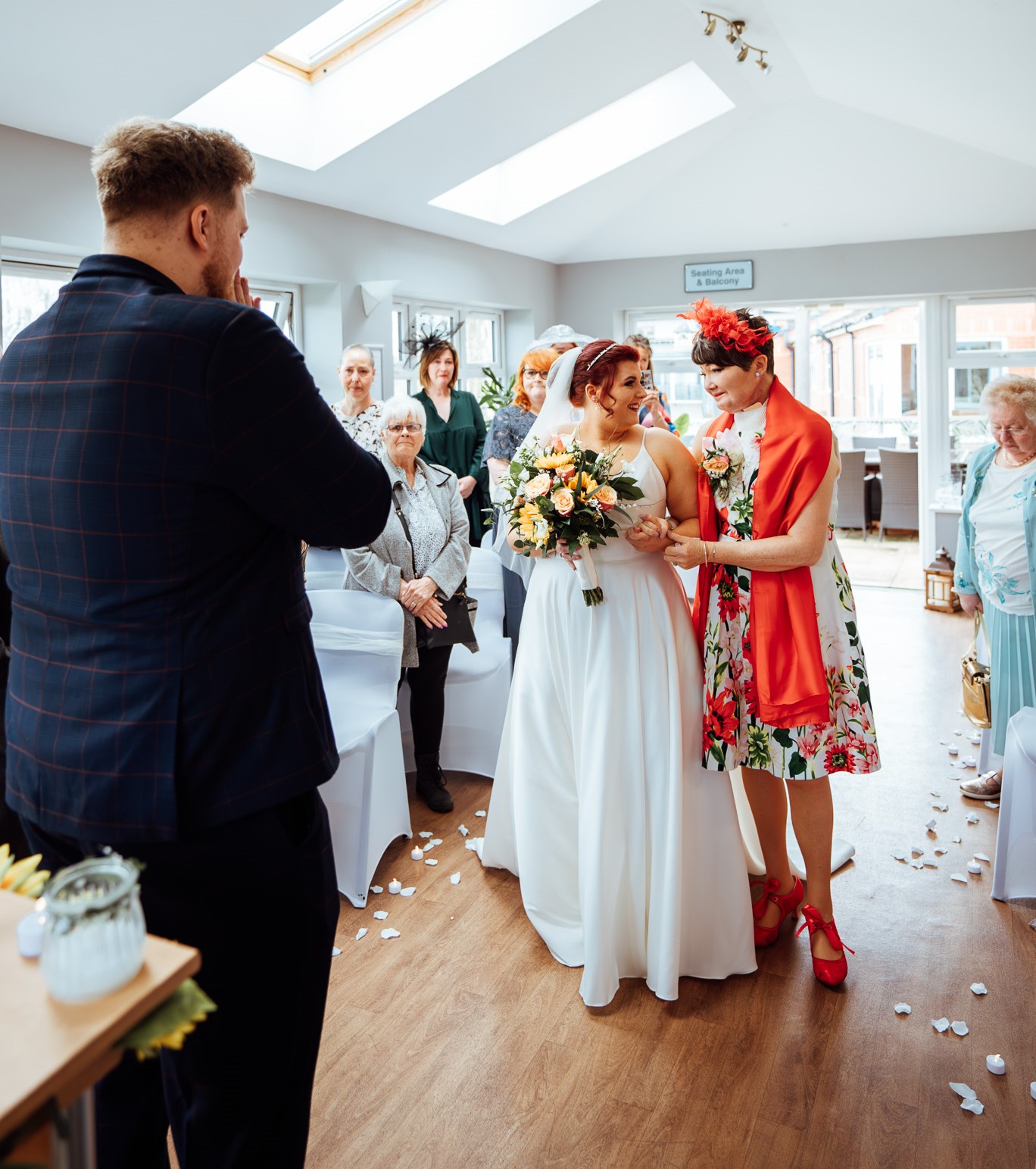 Andrea walking her daughter, Beth down the aisle at her wedding at Rotherham Hospice